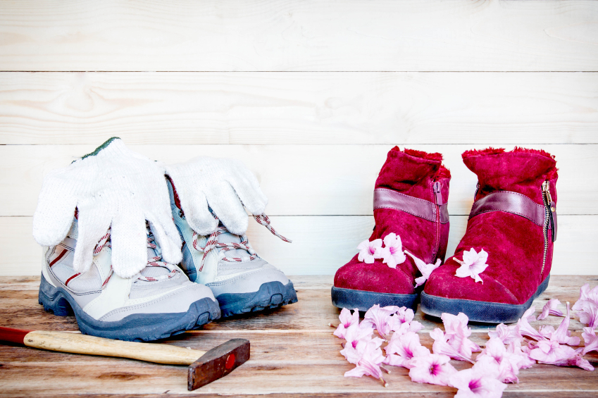 Men shoes work with winter red boots on wood background.