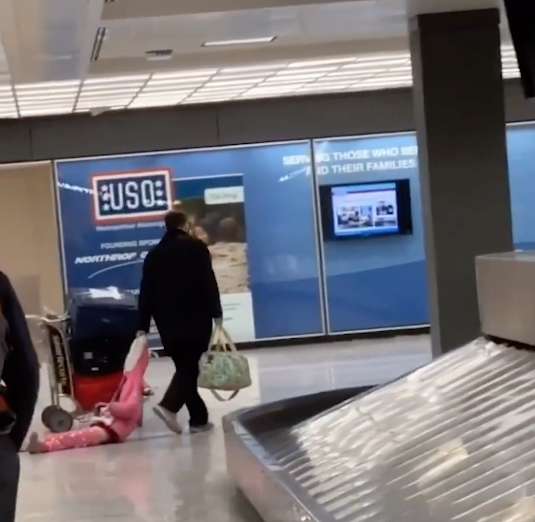 This dad dragging his child through an airport is the most relatable thing we've ever seen