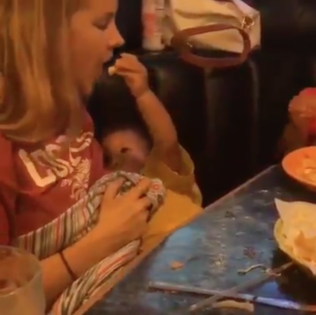 This video of a toddler feeding his mum chips while she breastfeeds him is too cute