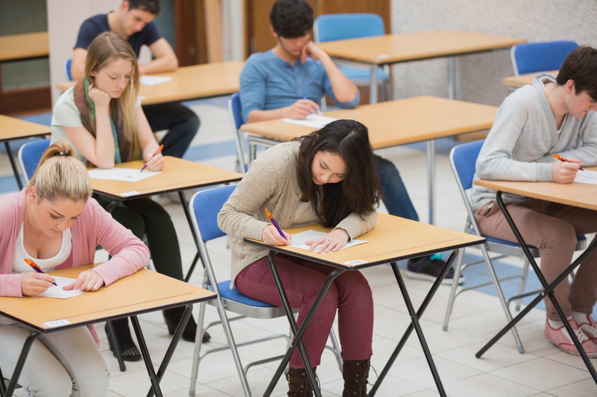 Teenagers taking an exam